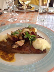 T-bone steak with root vegetables, mashed potatoes and steak butter 